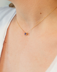 recycled-gold-heritage-pendant-birthstone-on-skin.png