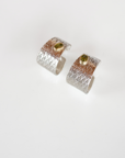 Reptilia silver earring with peridot, side view of the cuff-like shape.