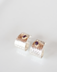 Reptilia silver earring with amethyst, side view of the cuff-like shape.