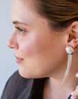 NOCTURNE earring add-on worn behind a stud earring, creating a striking silhouette with fine chains