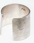 Interior and back view of the Reptilia Maxima silver cuff showing the open design and texture.