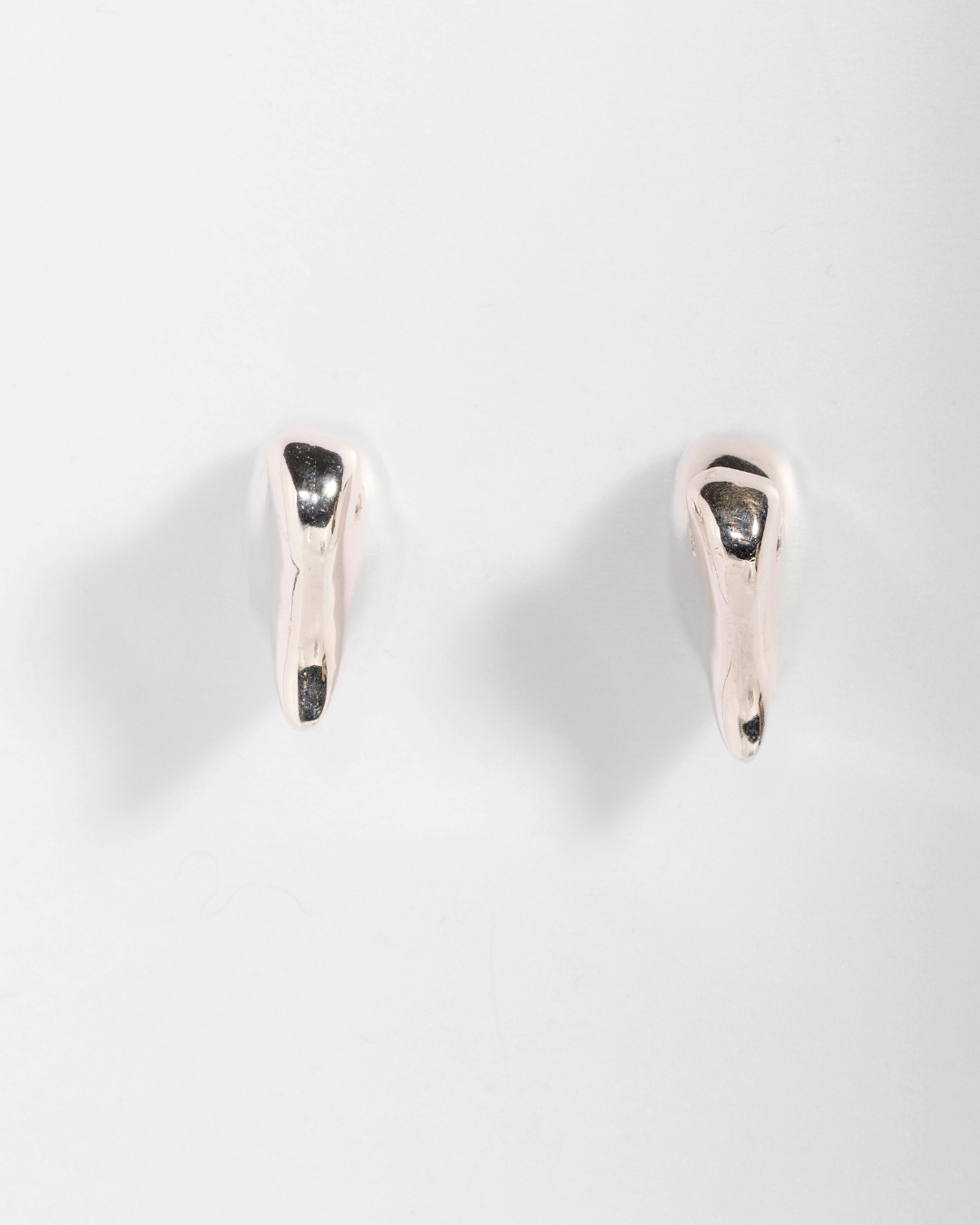 Bitten Heart earring in recycled sterling silver by Carlota Guardia Jewelry