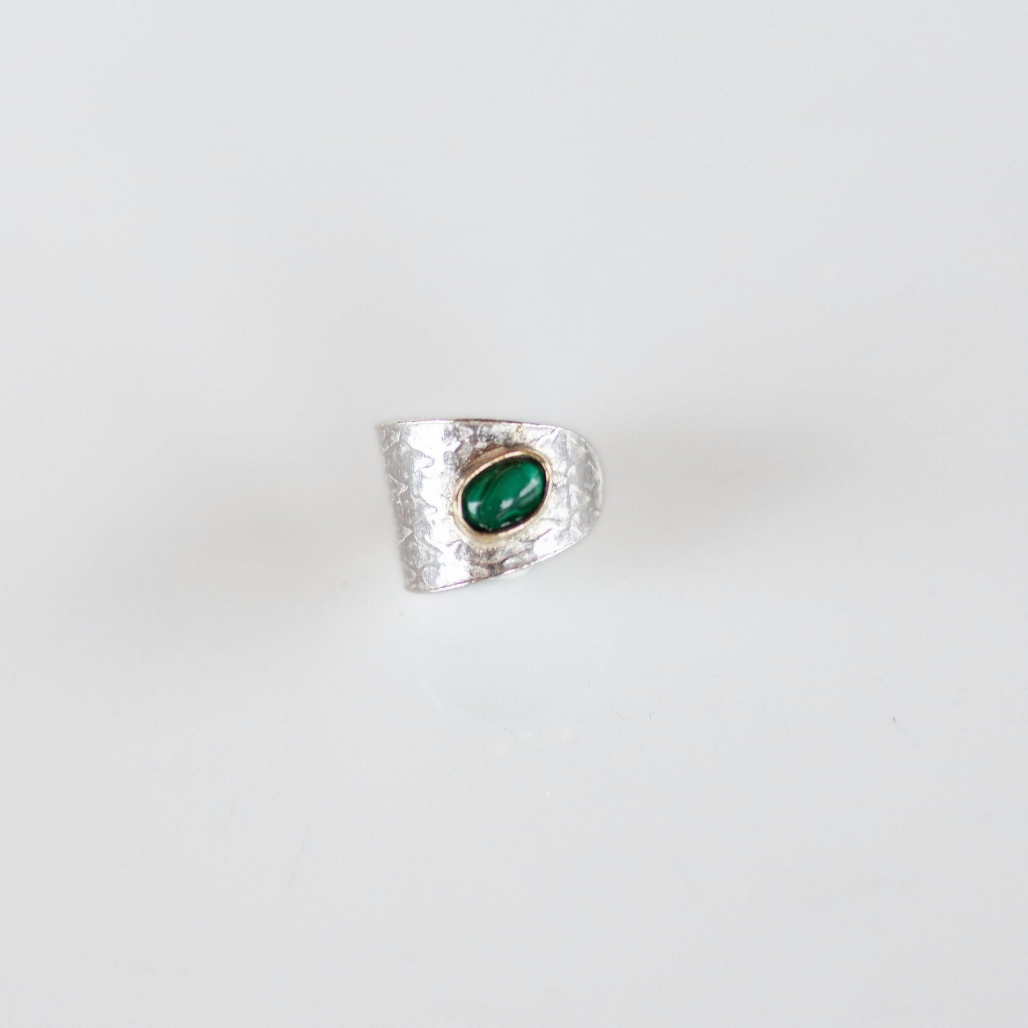 Reptilia silver earcuff with natural gemstone, finish and texture detail.