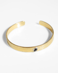 Reptilia Minima vermeil cuff with natural gemstone cabochon, front view on white.