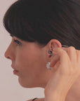 Halo Earrings in vermeil from the Reptilia collection worn by model, showcasing the organic and sculptural form