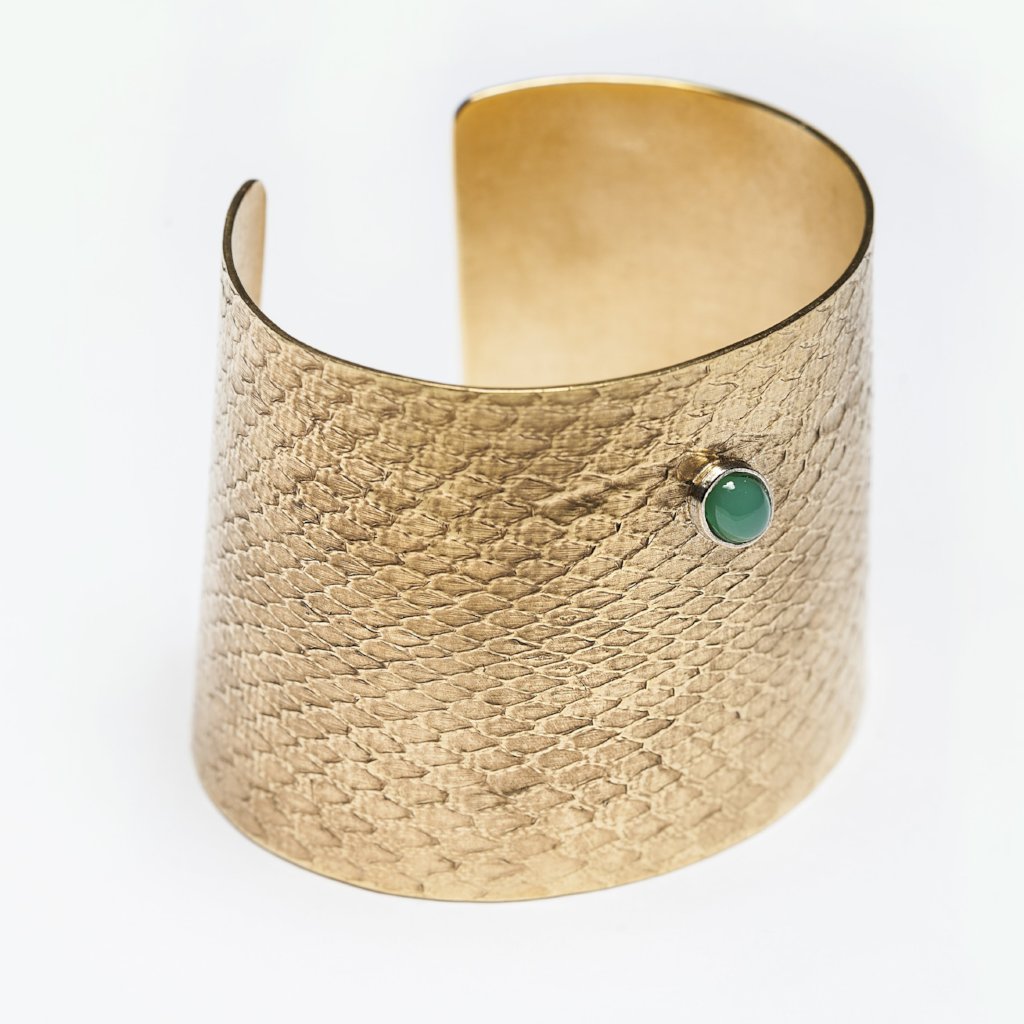 Reptilia Maxima vermeil cuff with green cabochon, angled view.