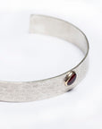 Natural gemstone cabochon detail on the Reptilia Mini silver bracelet.