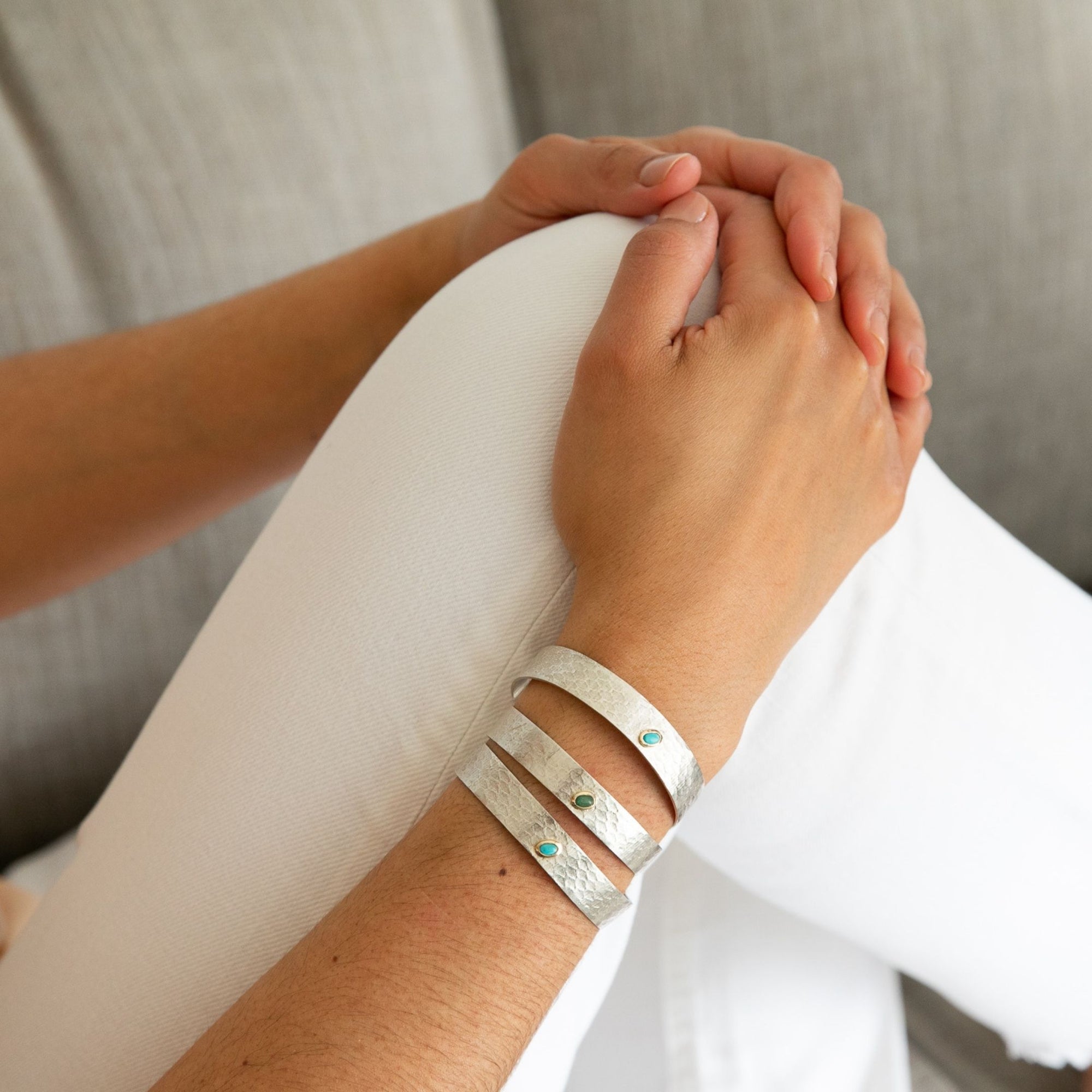 Angled view of the Reptilia Mini silver bracelet with natural gemstone cabochon.