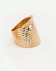 Reptilia gold ring with natural gemstone, side view showing the sculptural band.