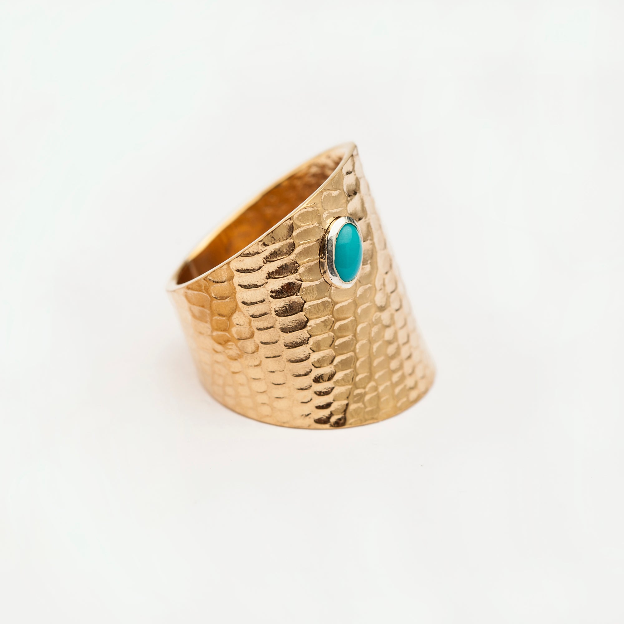 Angled side view of the Reptilia 14k gold ring with serpent-inspired scale texture.
