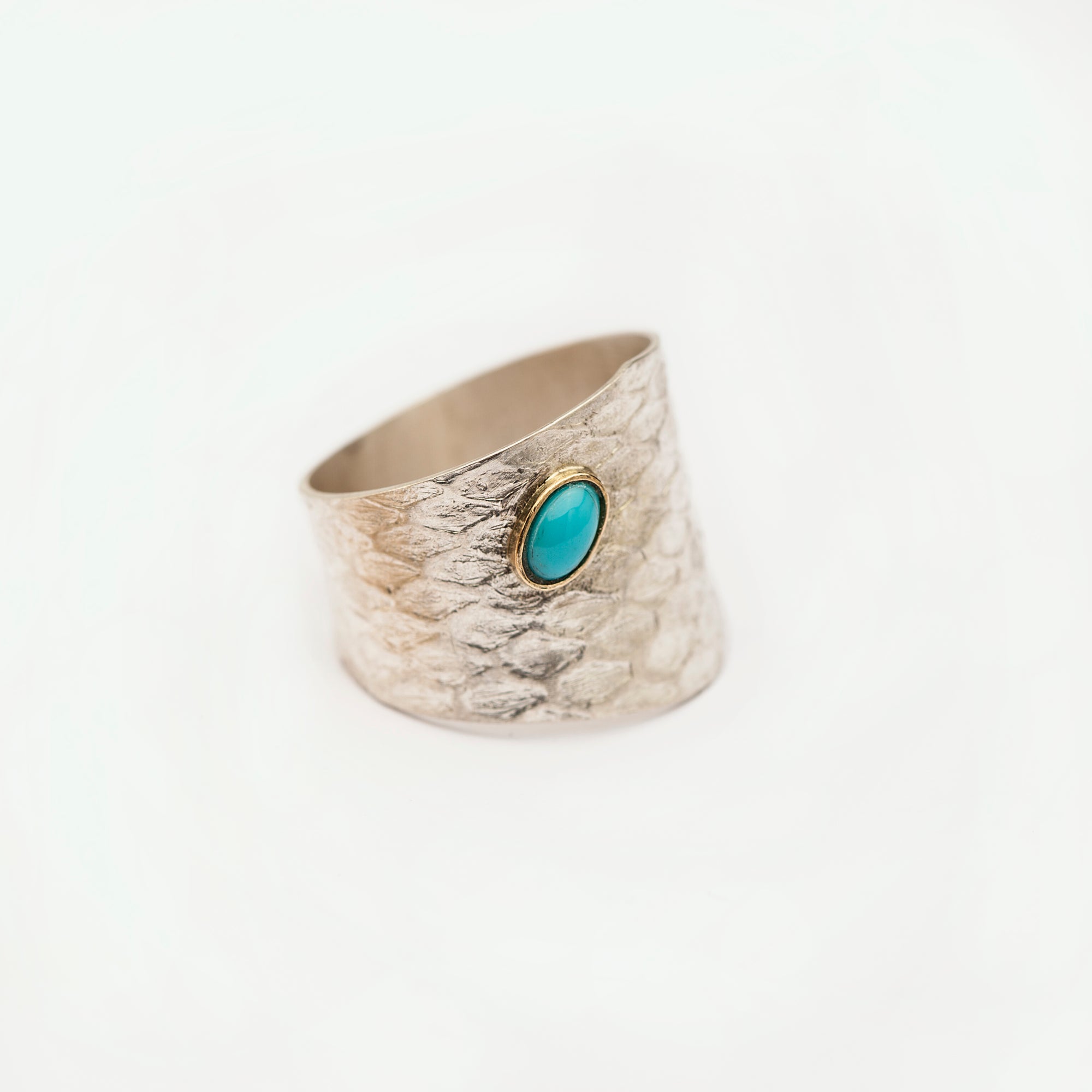 Reptilia silver ring with natural gemstone cabochon, front view on white.