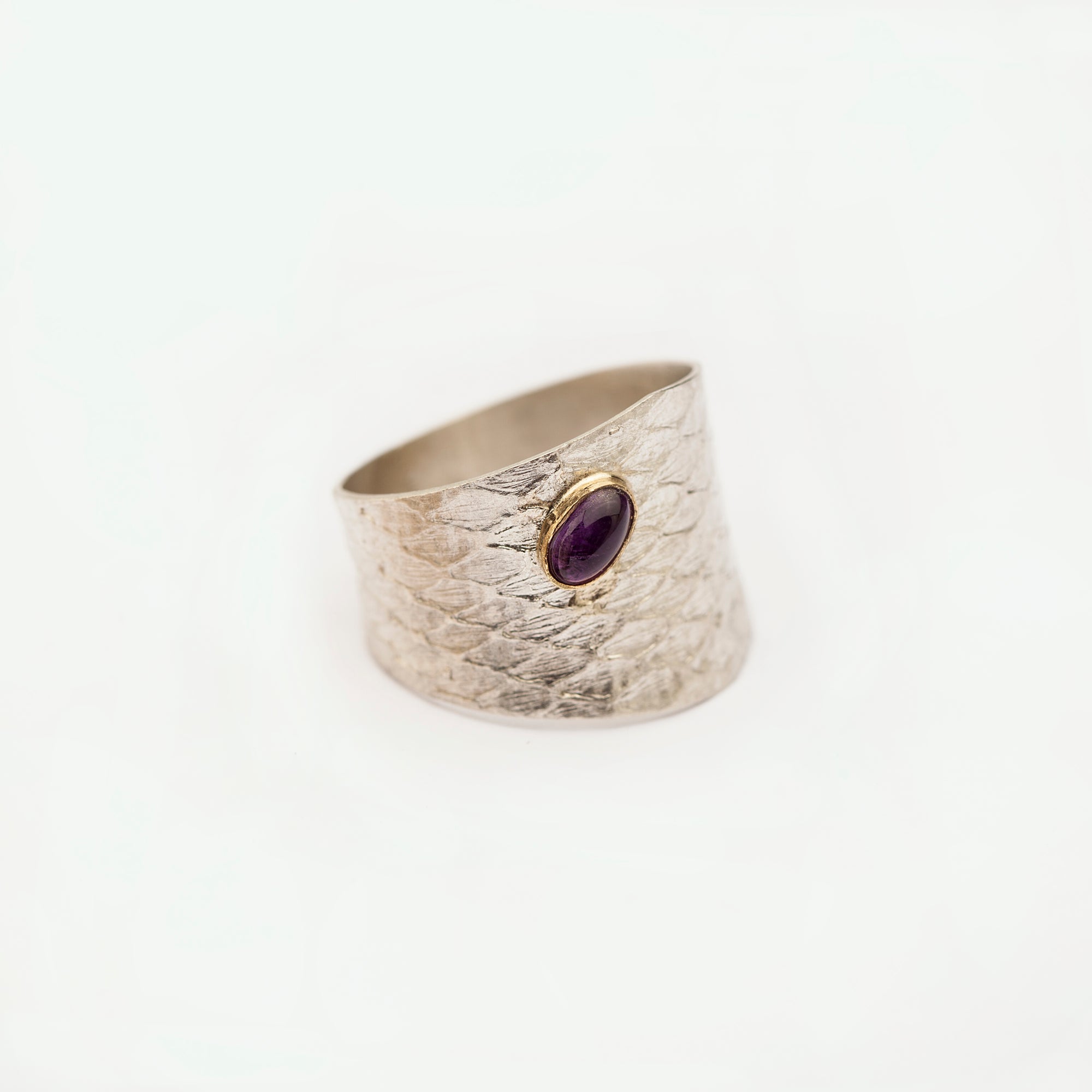 Angled front view of the Reptilia silver ring with natural gemstone.